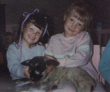 girls and baby sheep